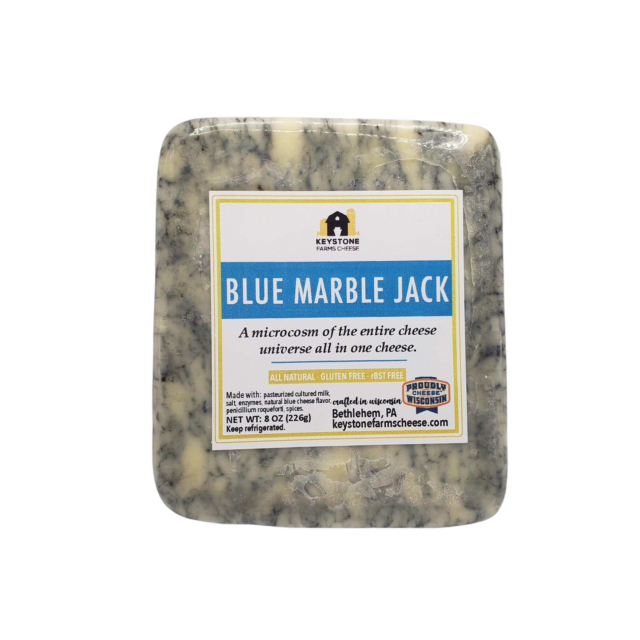 A wedge of Blue Marble Jack cheese showcasing its distinctive blue marbling and creamy texture, perfect for gourmet dishes.