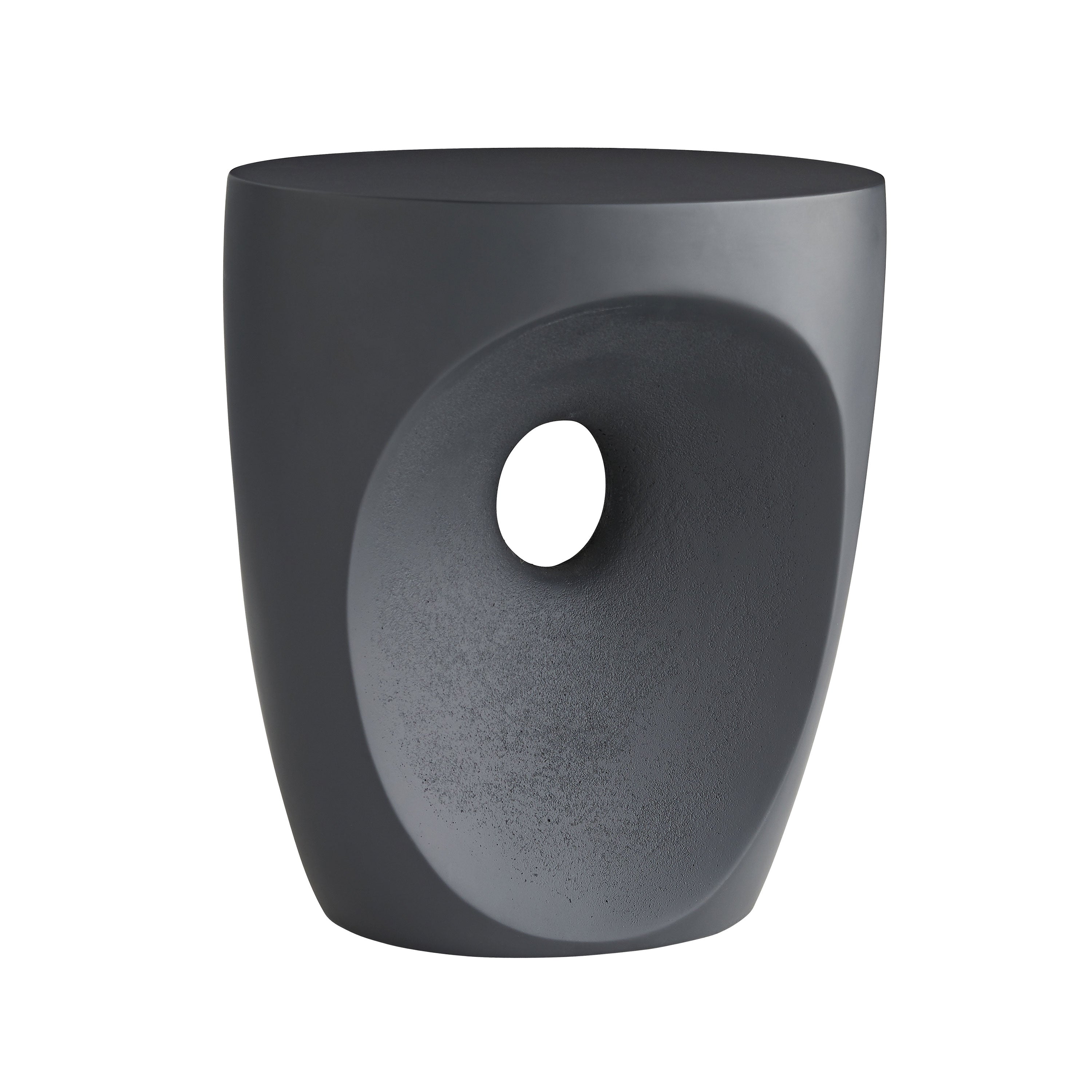 Brett Side Table in matte black concrete with a sculpted design, showcasing its unique concave façade and traditional drum-style shape.