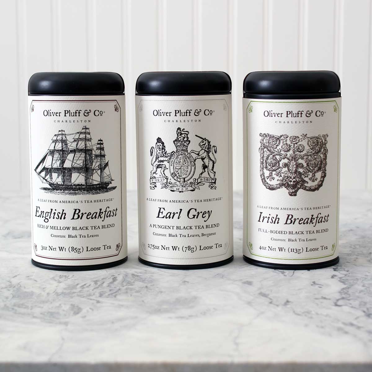 British Heritage Black Tea Trio featuring three signature tins of English Breakfast, Earl Grey, and Irish Breakfast loose teas.