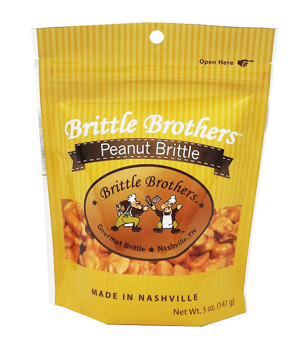 A 5 oz. bag of Brittle Brothers Gourmet Peanut Brittle featuring jumbo Virginia peanuts coated in buttery brittle.