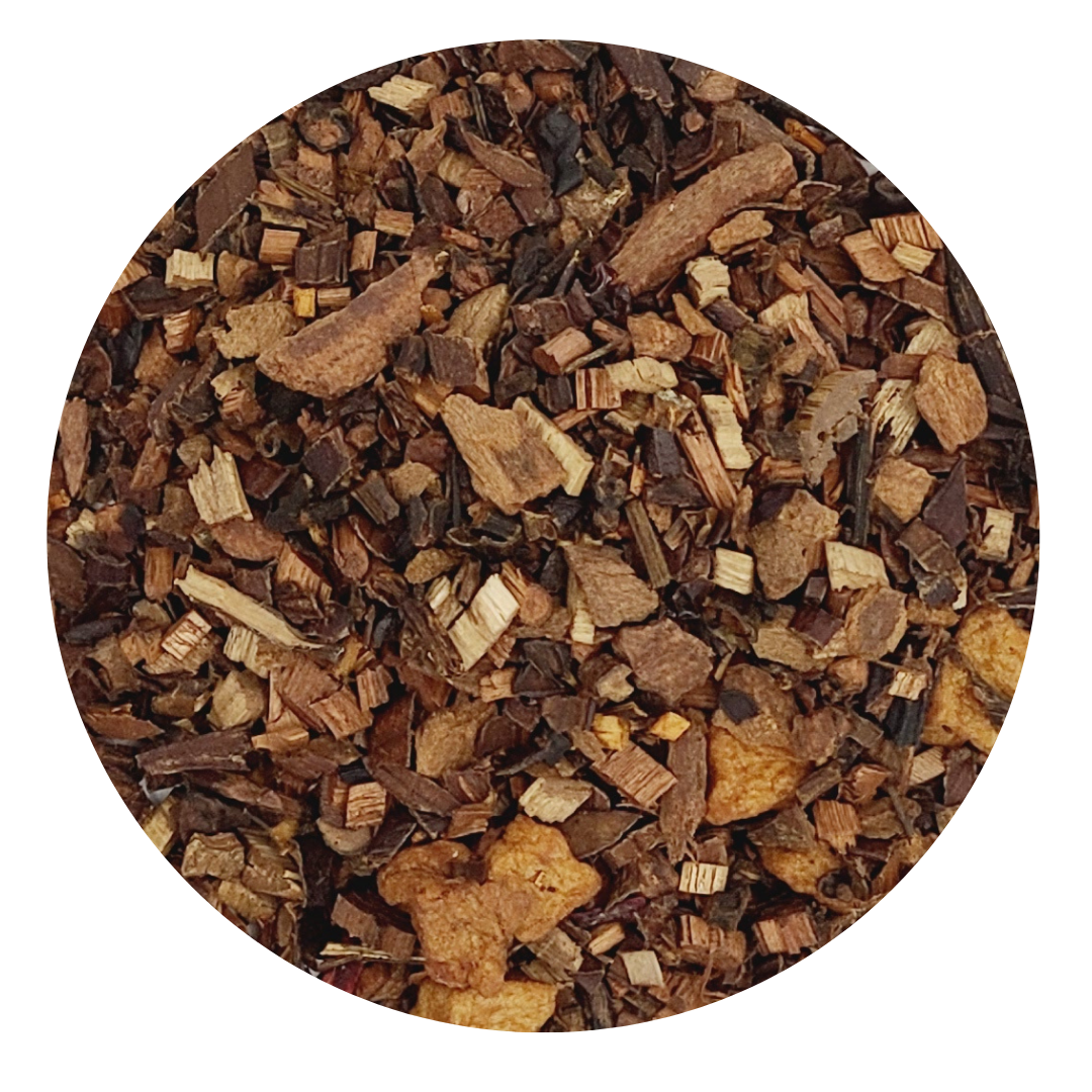 Bush Faerie Herbal Tea Blend in a loose leaf form, showcasing its organic ingredients like honeybush, apple pieces, and cinnamon chips.