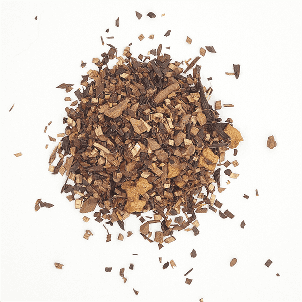 Bush Faerie Herbal Tea Blend in a loose leaf form, showcasing its organic ingredients like honeybush, apple pieces, and cinnamon chips.