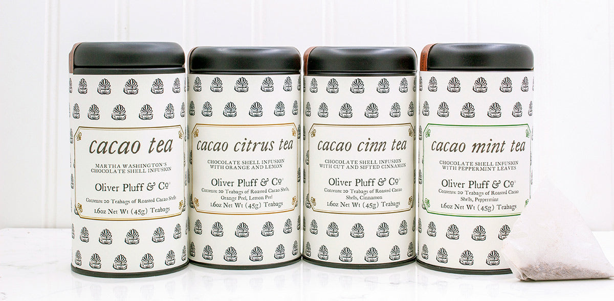 A tin of Cacao Citrus Teabags featuring roasted cacao shells and dried citrus peels, elegantly packaged.