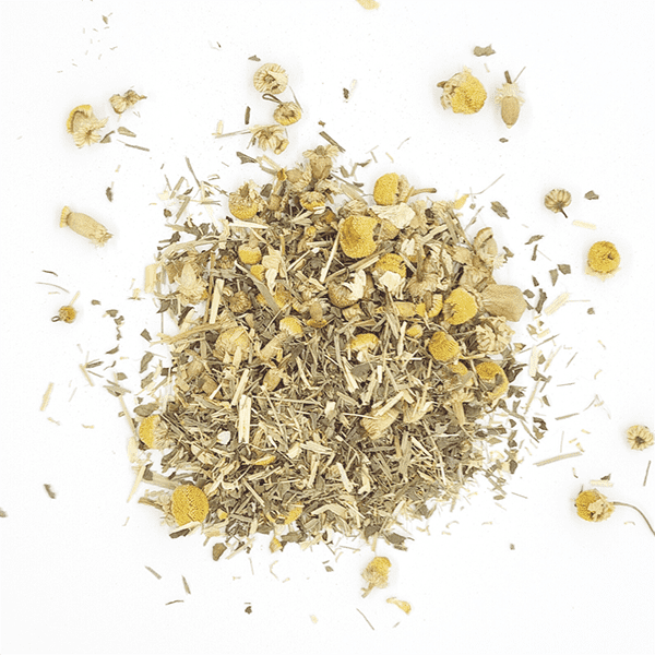 A calming herbal tea blend featuring chamomile, spearmint, and oat straw in a beautiful packaging, perfect for relaxation.