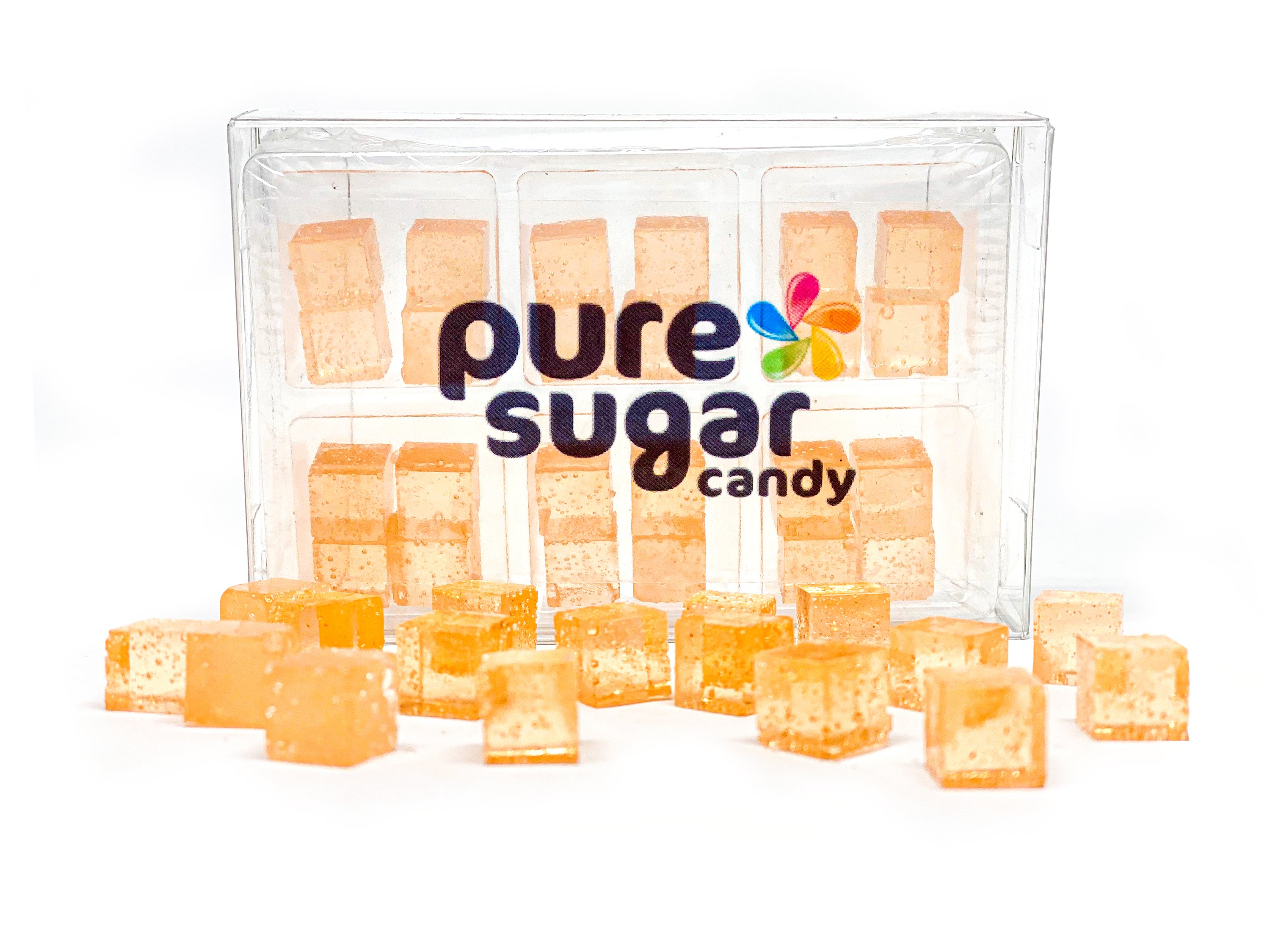 A tray of colorful apricot-flavored candy cubes, showcasing their vibrant orange color and small, cube shape.