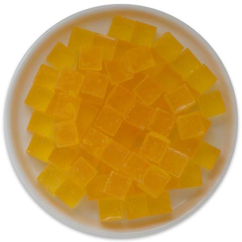 A colorful tray of Candy Cubes - Banana Cream Pie, featuring vibrant yellow and cream-colored cubes that resemble banana cream pie.