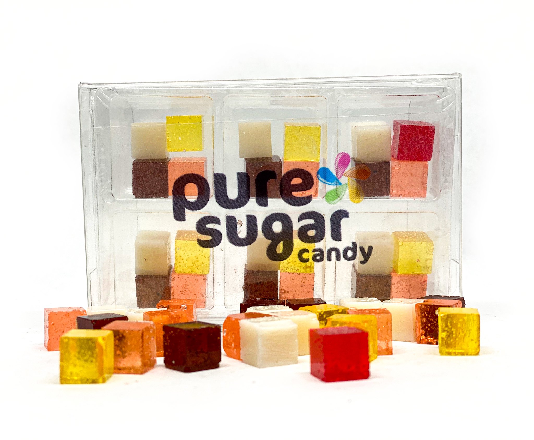 A colorful tray of Candy Cubes in Banana Split flavor, showcasing vibrant yellow, white, and brown cubes.