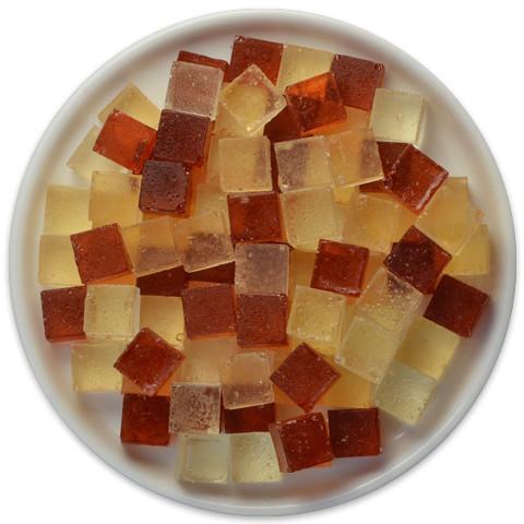 A tray of Candy Cubes featuring Boston Cream Pie flavor, showcasing chocolate and Bavarian cream cubes in a colorful presentation.