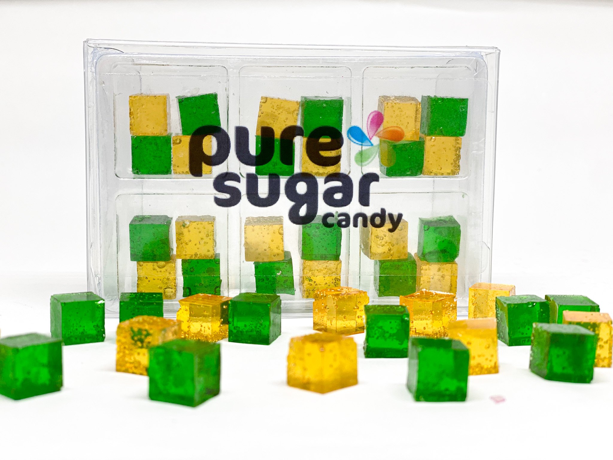 A tray of Candy Cubes - Caramel Apple featuring vibrant green apple and rich caramel flavored cubes, perfect for snacking.