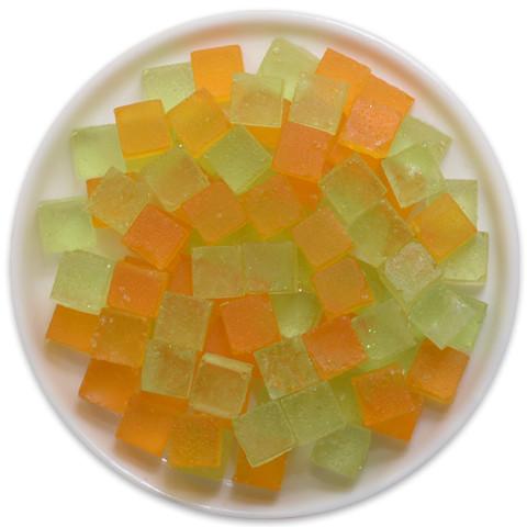 A tray of Candy Cubes - Caramel Apple featuring vibrant green apple and rich caramel flavored cubes, perfect for snacking.