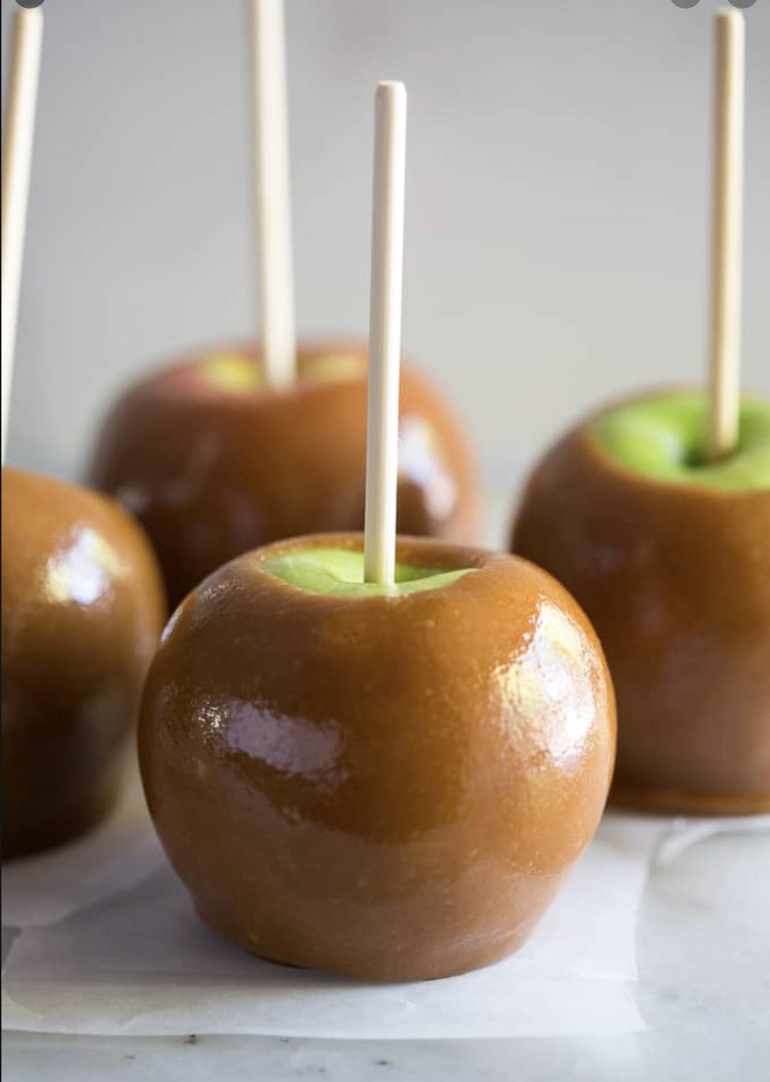 A tray of Candy Cubes - Caramel Apple featuring vibrant green apple and rich caramel flavored cubes, perfect for snacking.