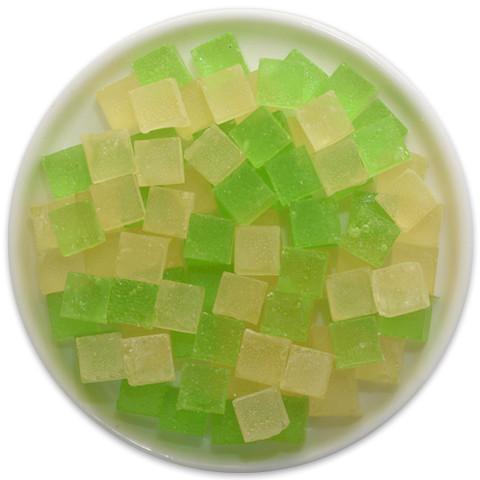 A vibrant tray of Key Lime Pie Candy Cubes, showcasing their bright green color and unique cube shape, perfect for a sweet treat.