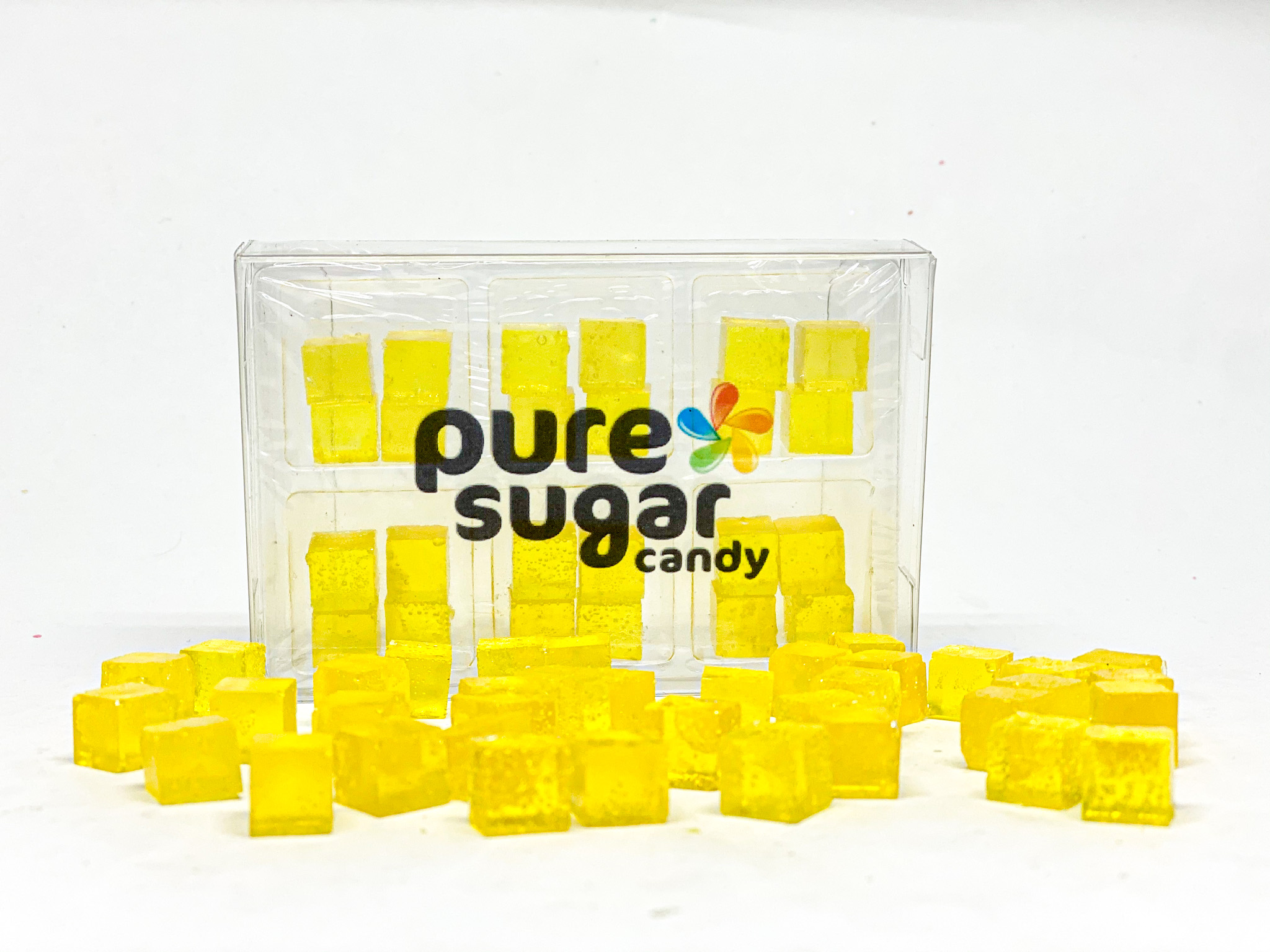 A colorful tray of Candy Cubes - Lemonade, featuring 24 vibrant yellow cubes, each showcasing a refreshing lemonade flavor.