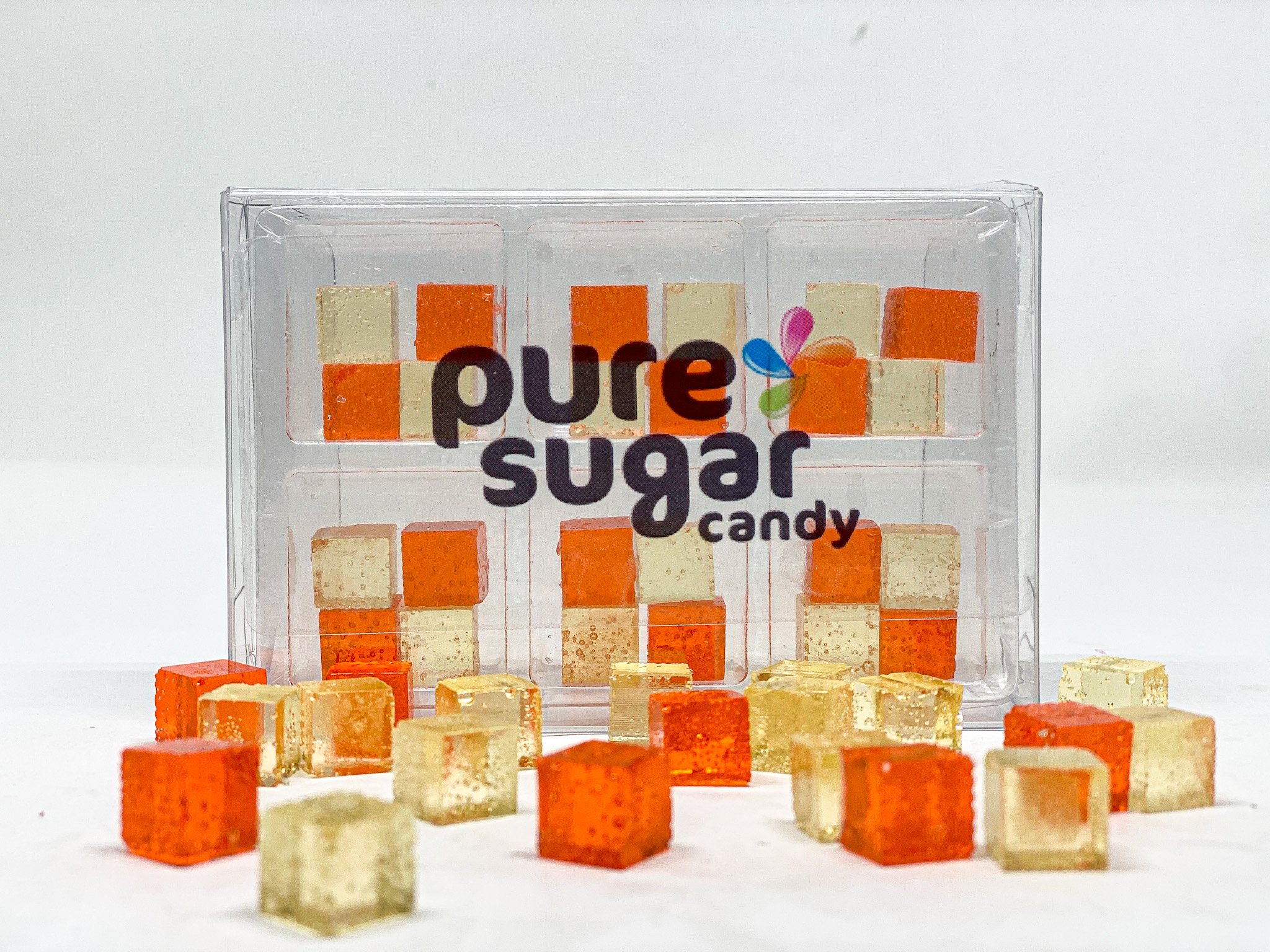 A tray of Candy Cubes in Peach Pie flavor, showcasing vibrant orange cubes with a glossy finish, perfect for snacking.