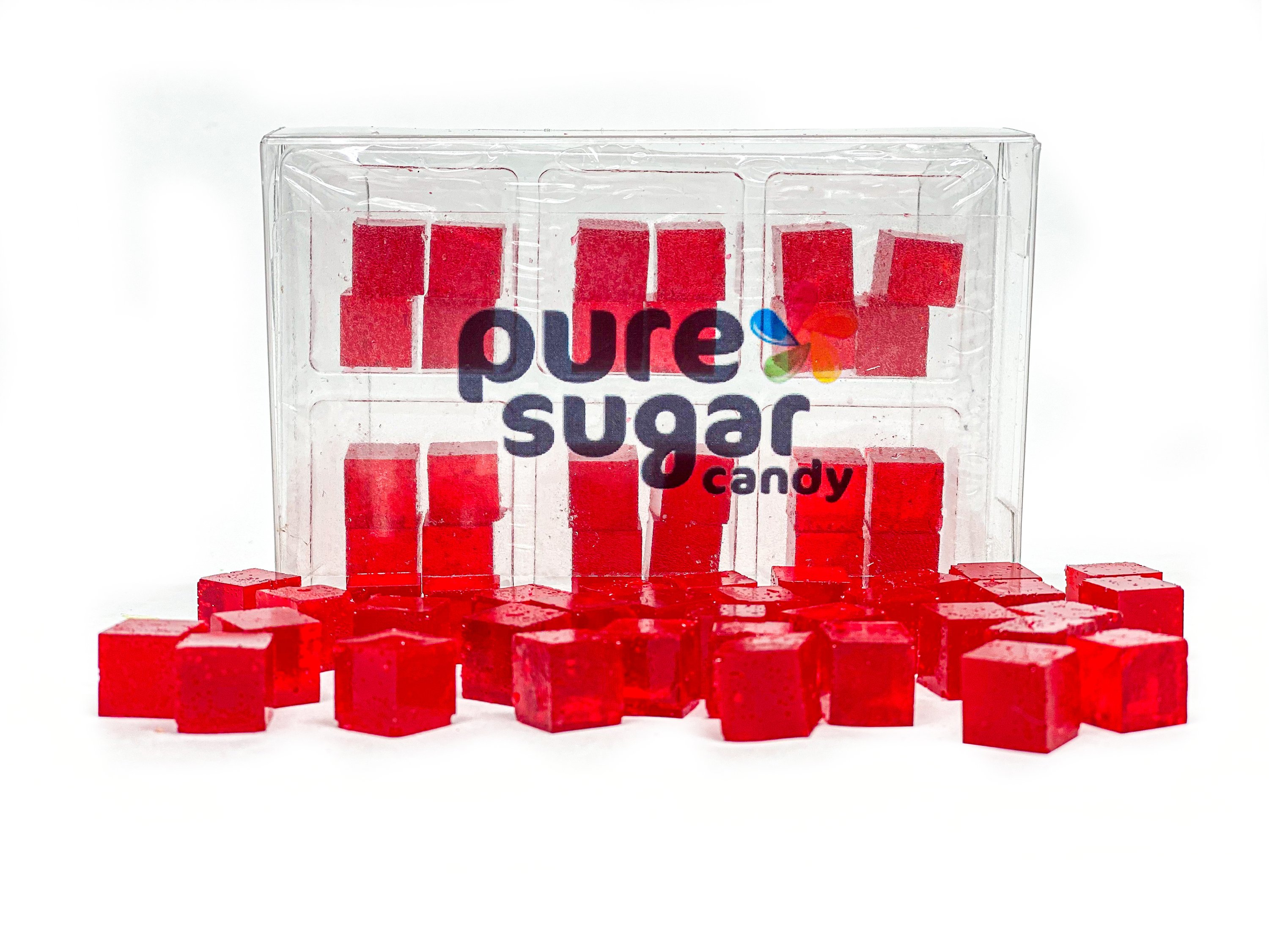 A tray of Candy Cubes in pomegranate flavor, showcasing vibrant red cubes with a glossy finish, perfect for snacking.