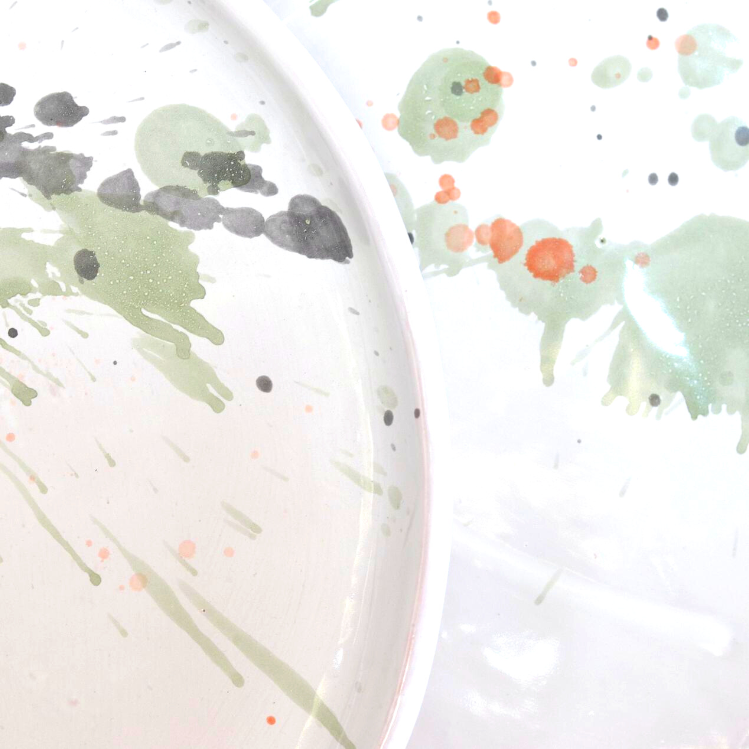 Ceramic Handmade Dinnerplate featuring a unique watercolour design in shades of green, grey, blue, and subtle orange, showcasing artisanal craftsmanship.