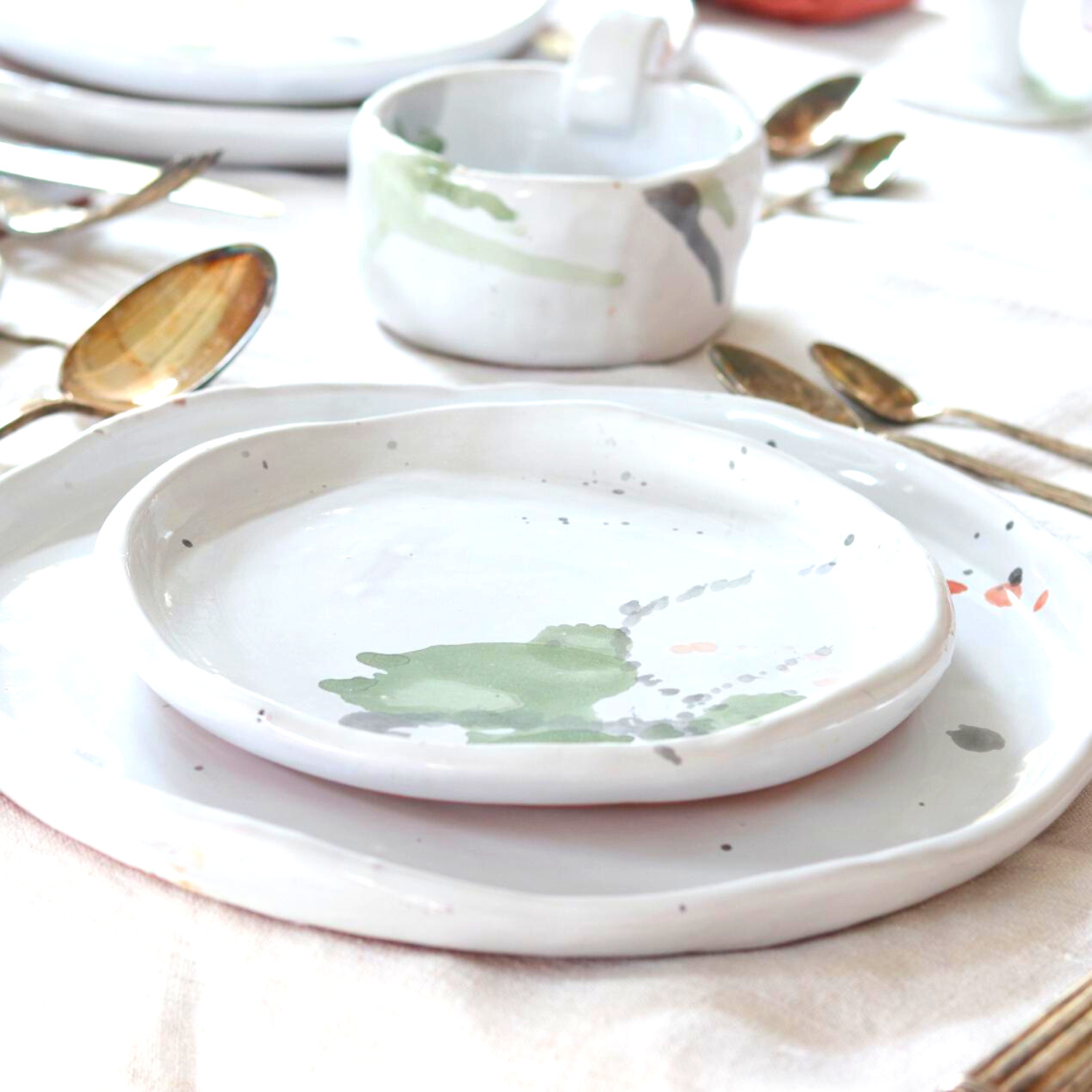 Ceramic Handmade Salad Plate featuring a unique watercolour design in shades of green, grey, blue, and subtle orange, showcasing artisan craftsmanship.