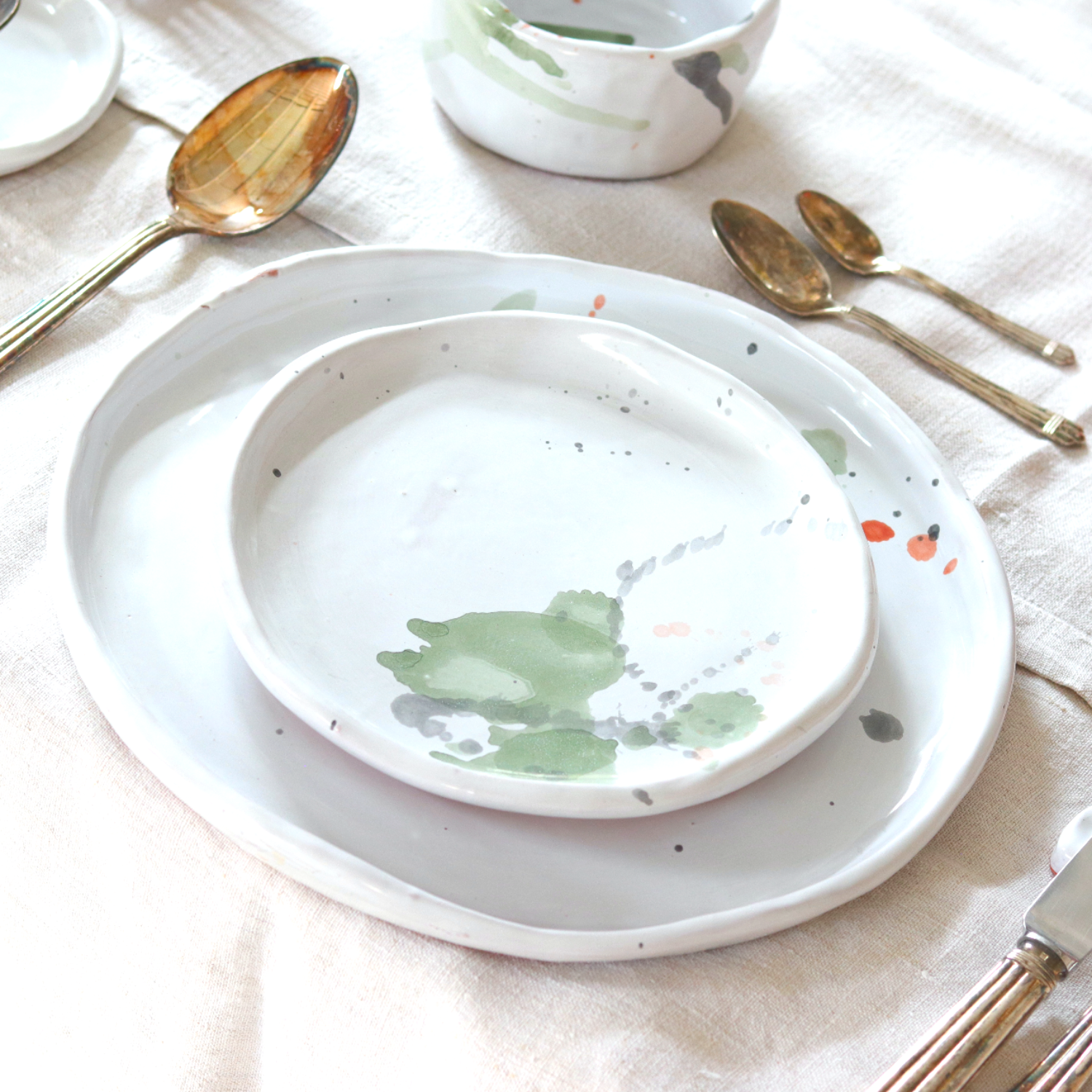 Ceramic Handmade Salad Plate featuring a unique watercolour design in shades of green, grey, blue, and subtle orange, showcasing artisan craftsmanship.