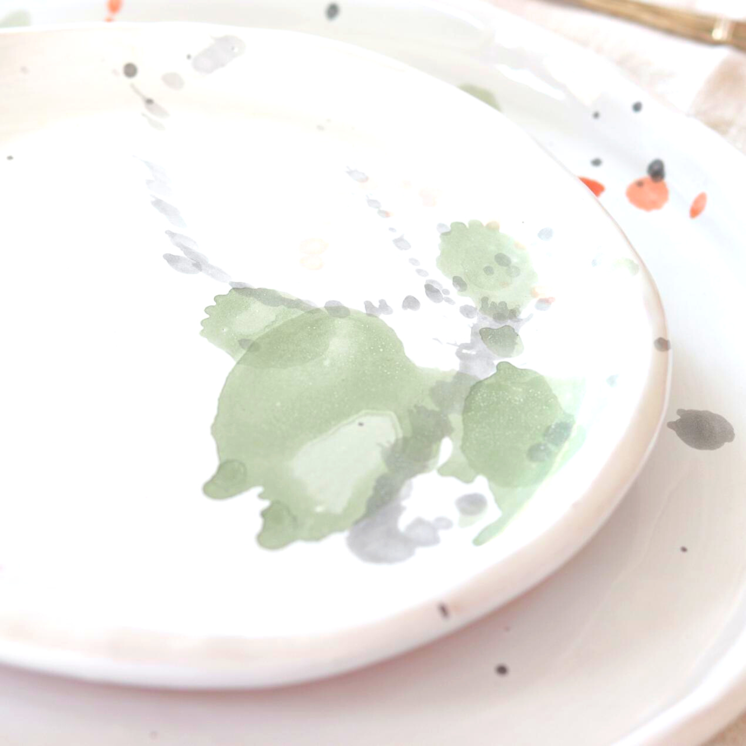 Ceramic Handmade Salad Plate featuring a unique watercolour design in shades of green, grey, blue, and subtle orange, showcasing artisan craftsmanship.