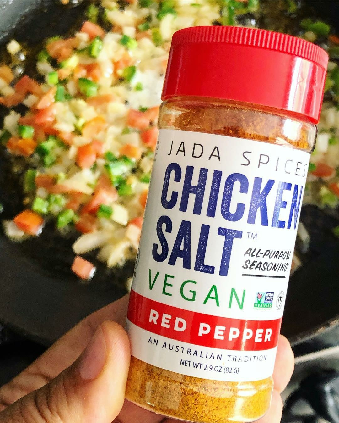 A jar of Chicken Salt Red Pepper Flavor seasoning with a vibrant label showcasing its spicy ingredients.