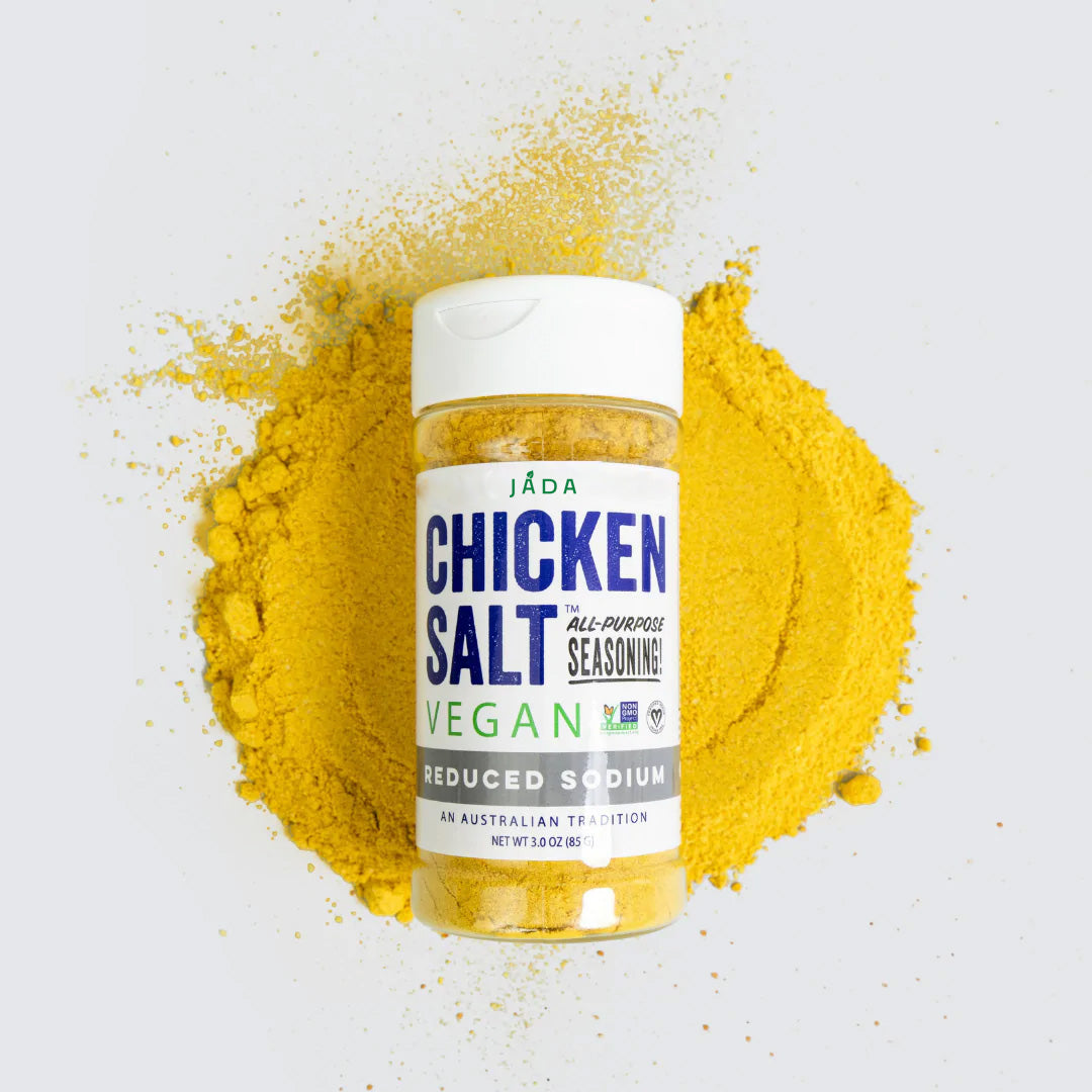 A jar of Chicken Salt Reduced Sodium Flavor seasoning with a vibrant label, showcasing its vegan and reduced sodium benefits.