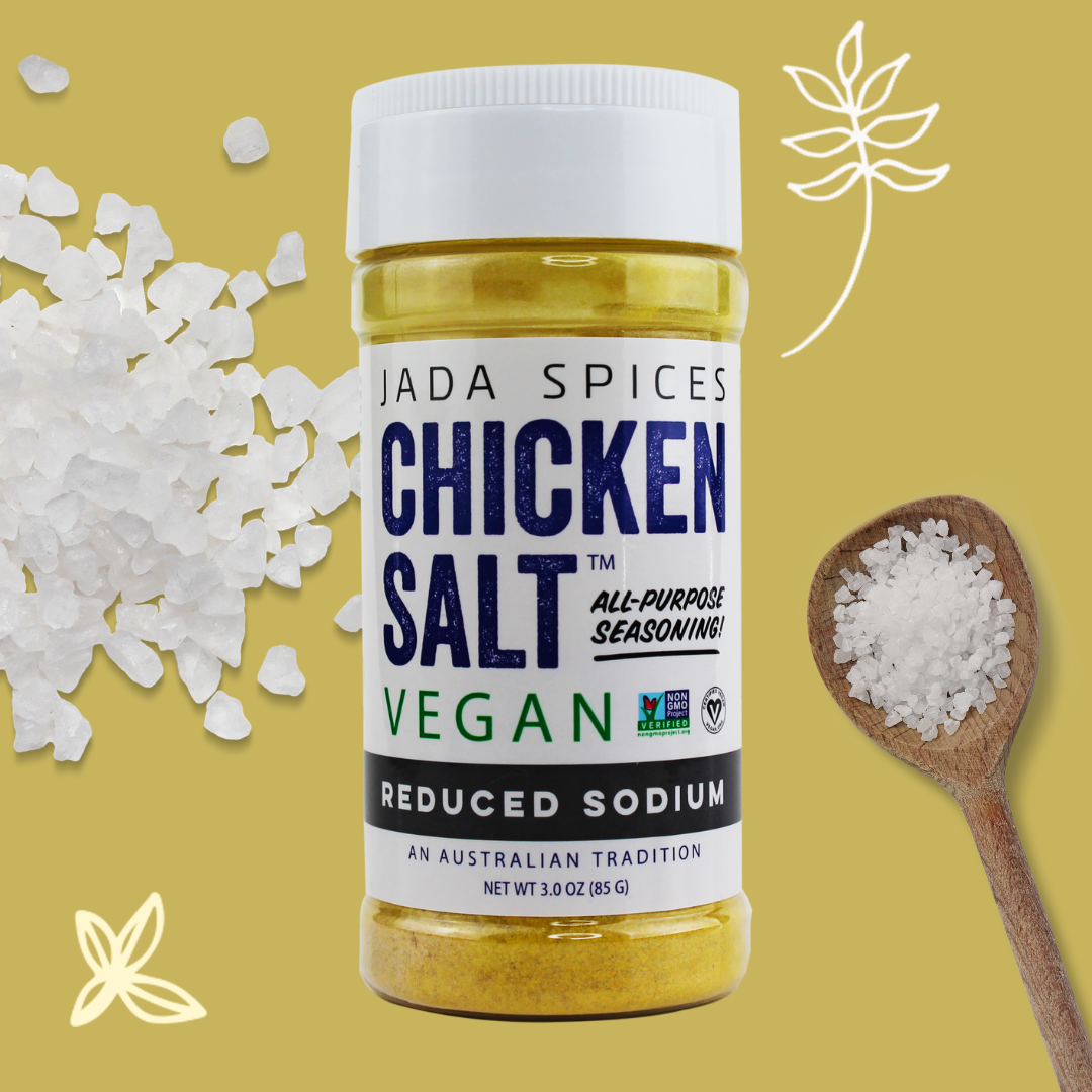 A jar of Chicken Salt Reduced Sodium Flavor seasoning with a vibrant label, showcasing its vegan and reduced sodium benefits.