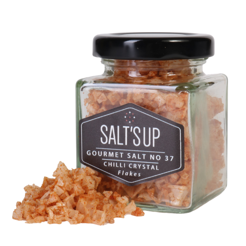 A jar of CHILLI crystal salt flakes showcasing pyramid-shaped sea salt infused with Birdeye chilli and paprika.