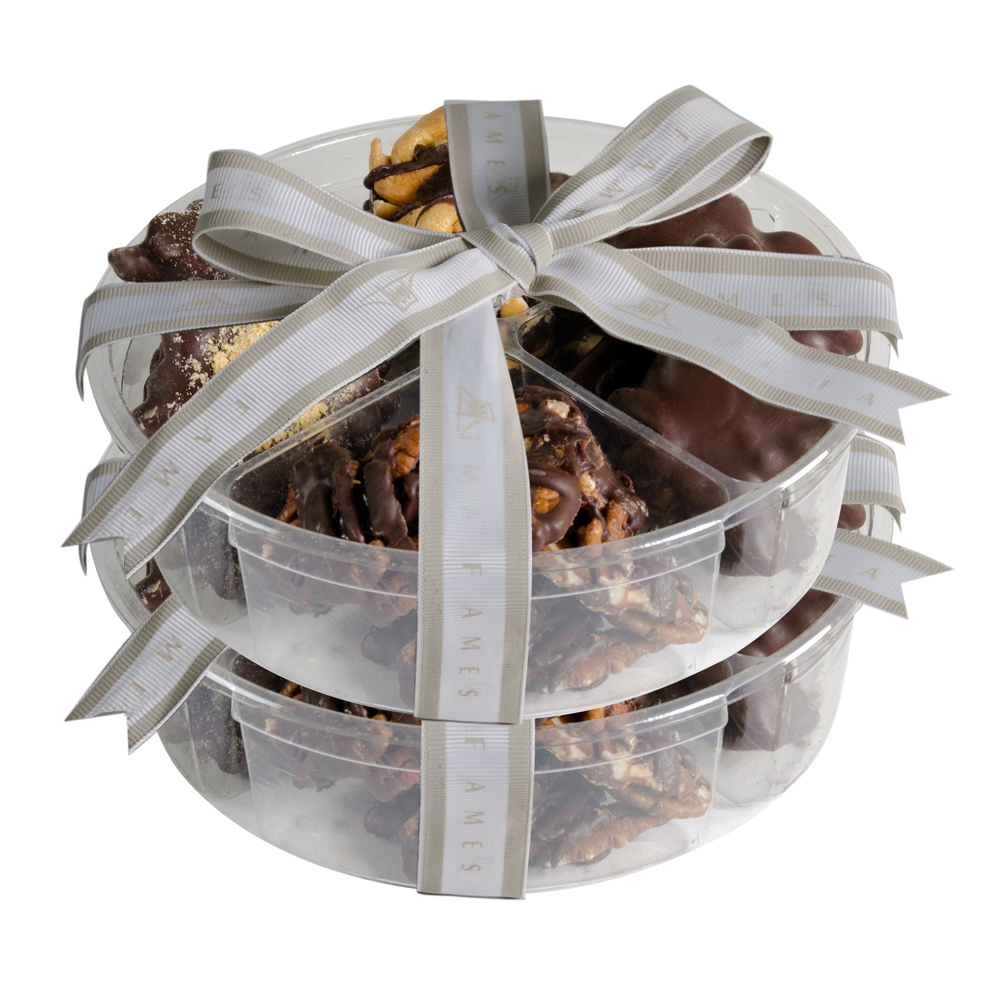 A beautifully arranged Chocolate Nuts Gift Set featuring pecan patties, almond clusters, caramel brittles, and cashew patties in an elegant tray.