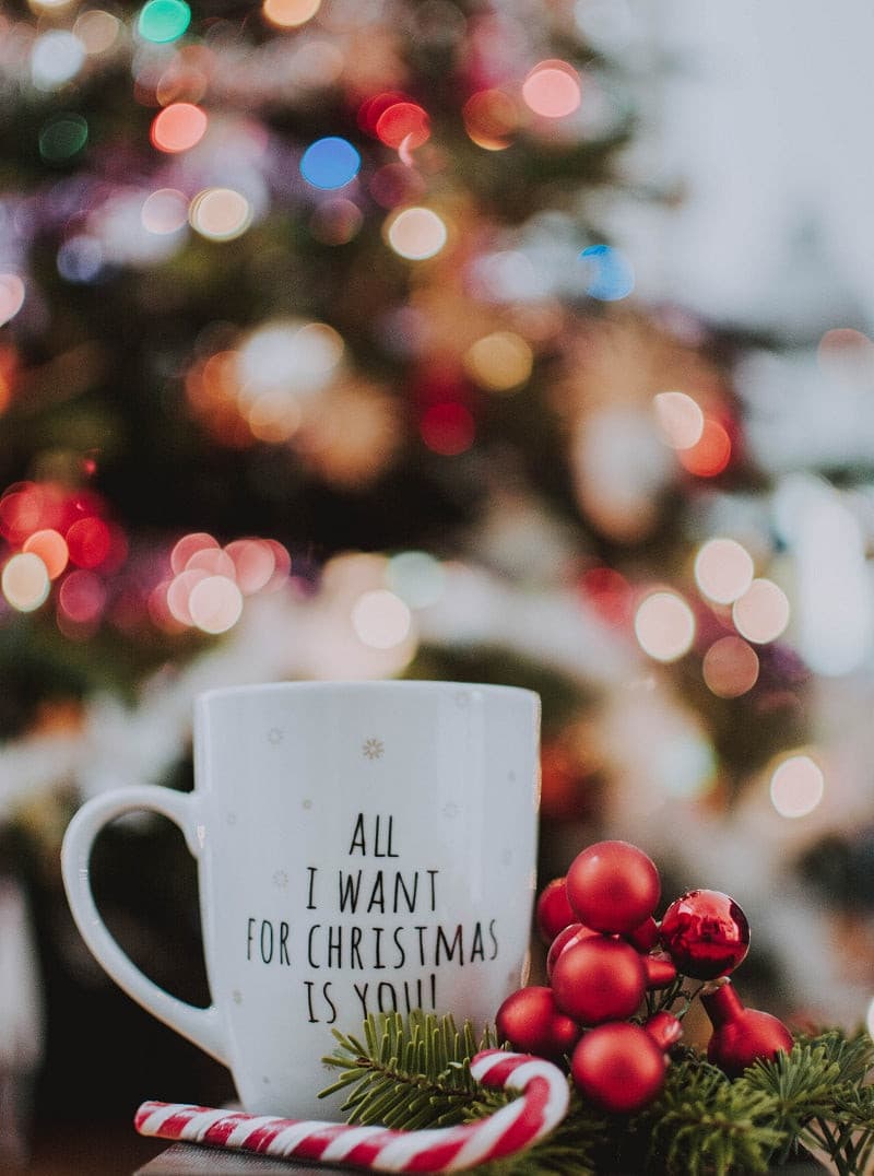 A bag of Monte Rosa Christmas Blend Coffee featuring festive packaging, showcasing rich coffee beans and a warm holiday theme.