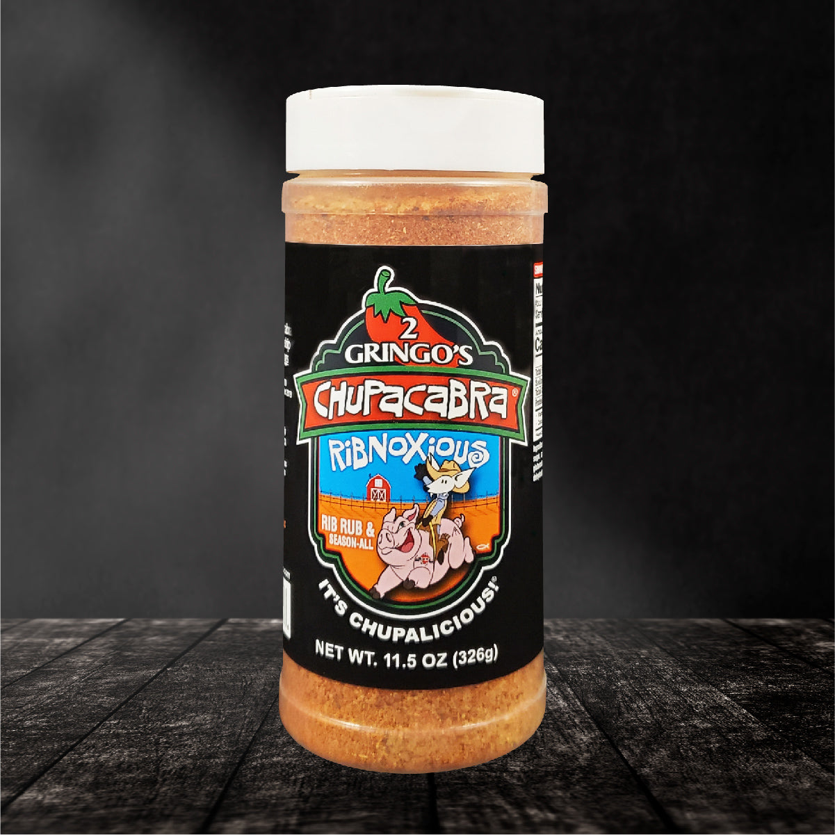 Chupacabra Ribnoxious 12 Oz seasoning rub bottle with a vibrant label showcasing its sweet and spicy flavor profile.