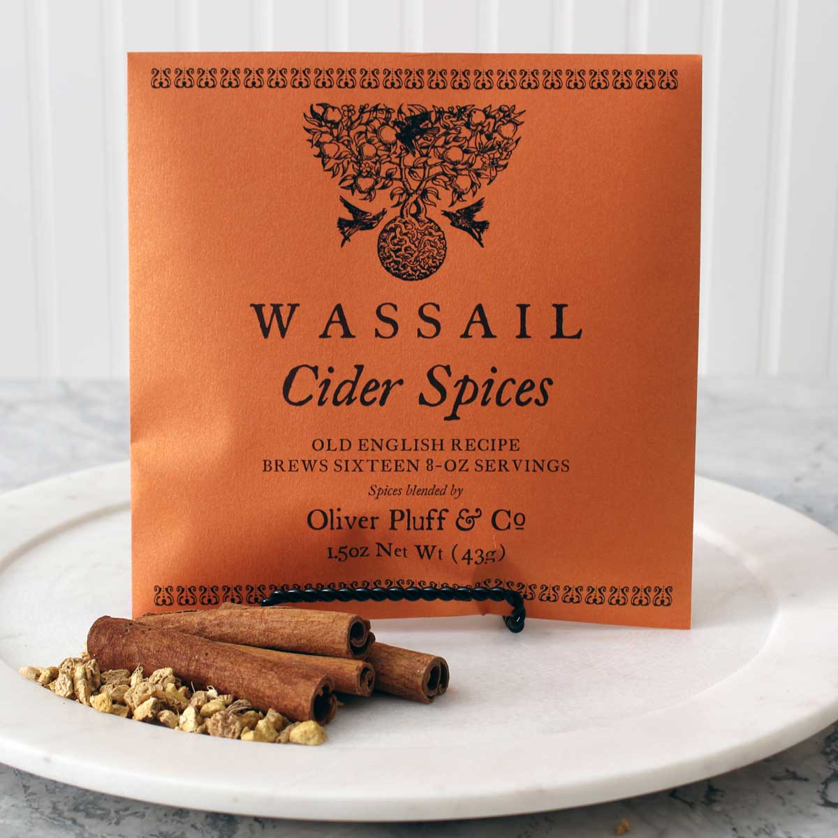 A 1-gallon package of Cider Spices Wassail featuring cinnamon sticks, ginger, and nutmeg, perfect for brewing traditional mulled cider.