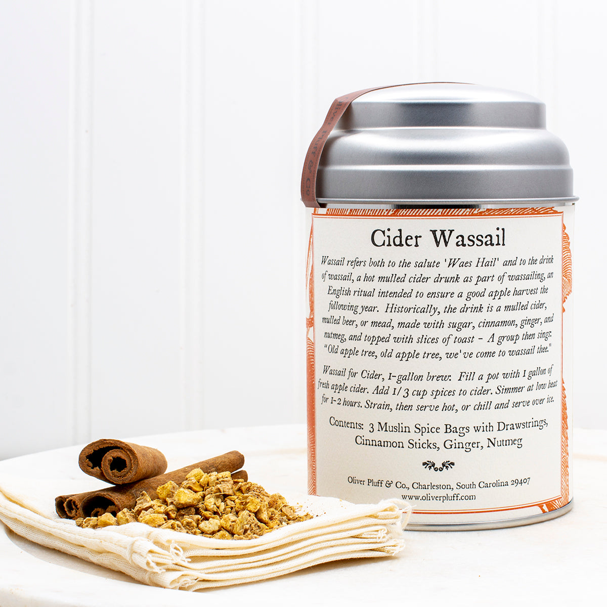 Cider Spices Wassail Kit featuring muslin spice bags, cinnamon sticks, ginger, and nutmeg, beautifully packaged for brewing mulled cider.