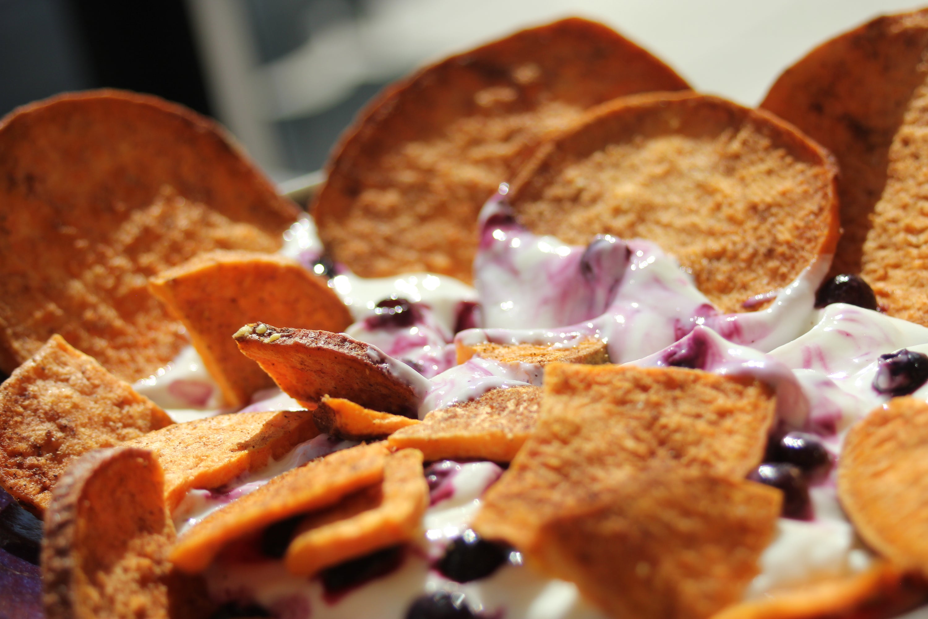 A close-up of organic cinnamon sweetpotato slices, showcasing their golden-brown color and texture, perfect for snacking or dessert toppings.