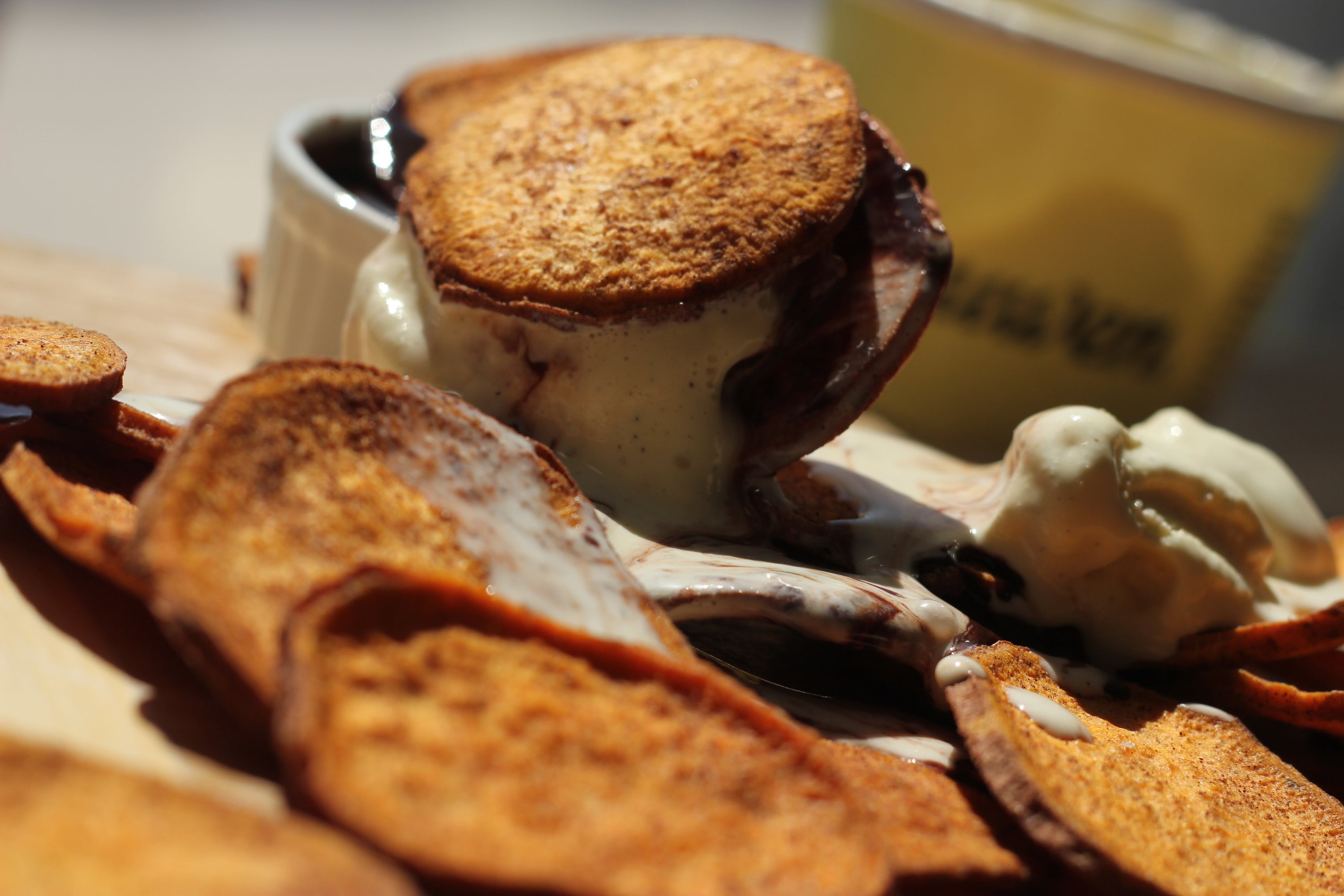 A close-up of organic cinnamon sweetpotato slices, showcasing their golden-brown color and texture, perfect for snacking or dessert toppings.