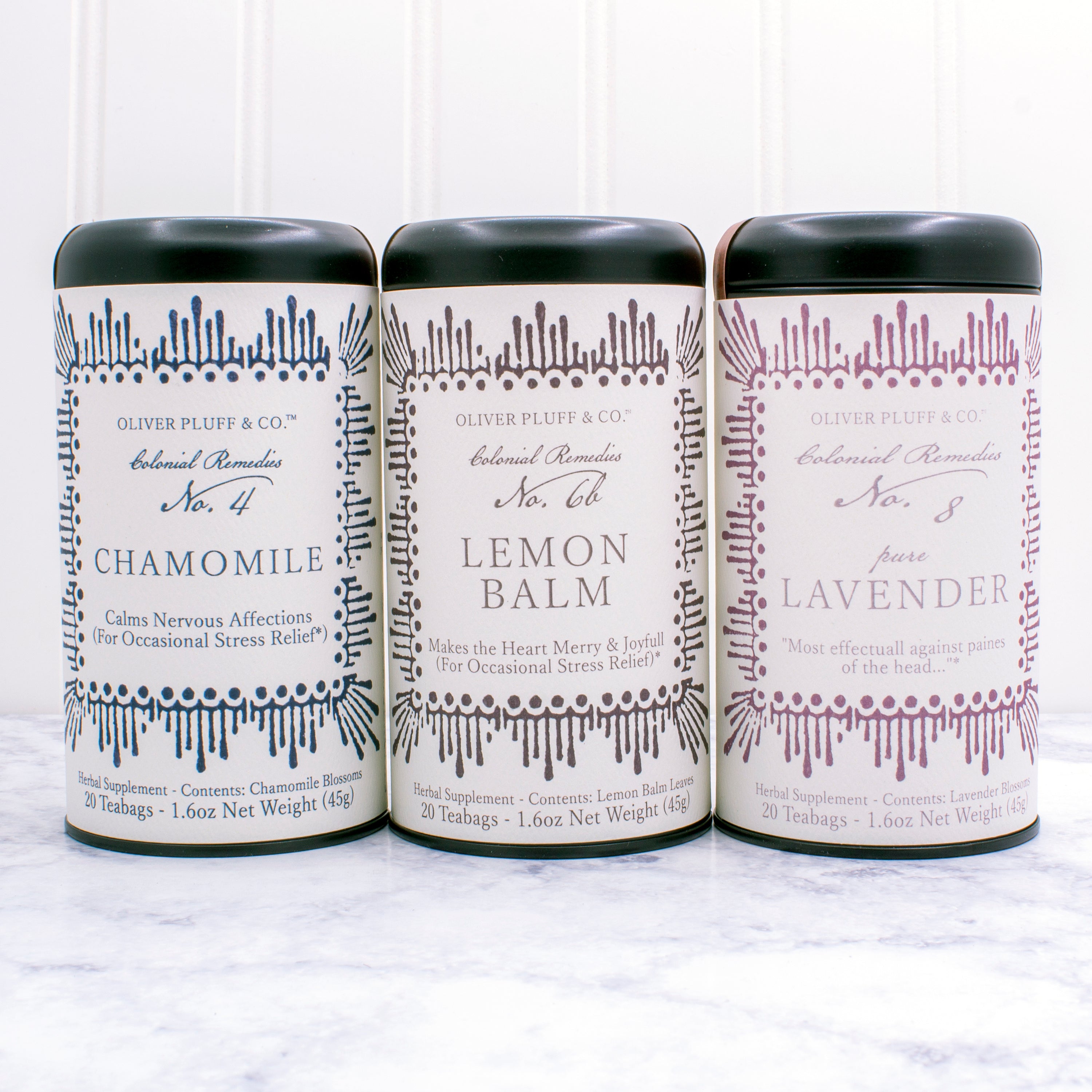 Colonial Remedies Relaxing Trio gift set featuring three herbal tea blends: chamomile, lemon balm, and lavender in elegant matte black tins.