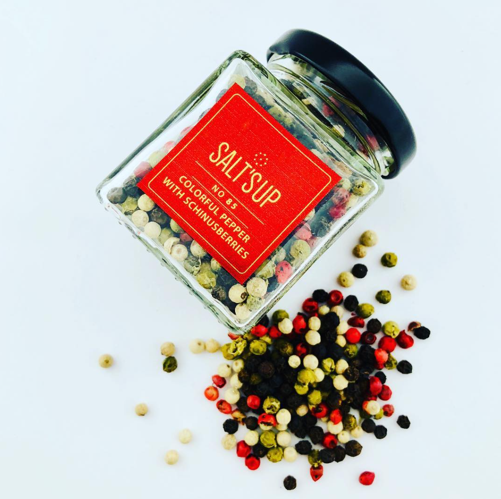 Colorful Schinusberries pepper mix in an ecopack, featuring black, white, green, and pink pepper berries, ideal for enhancing dishes.