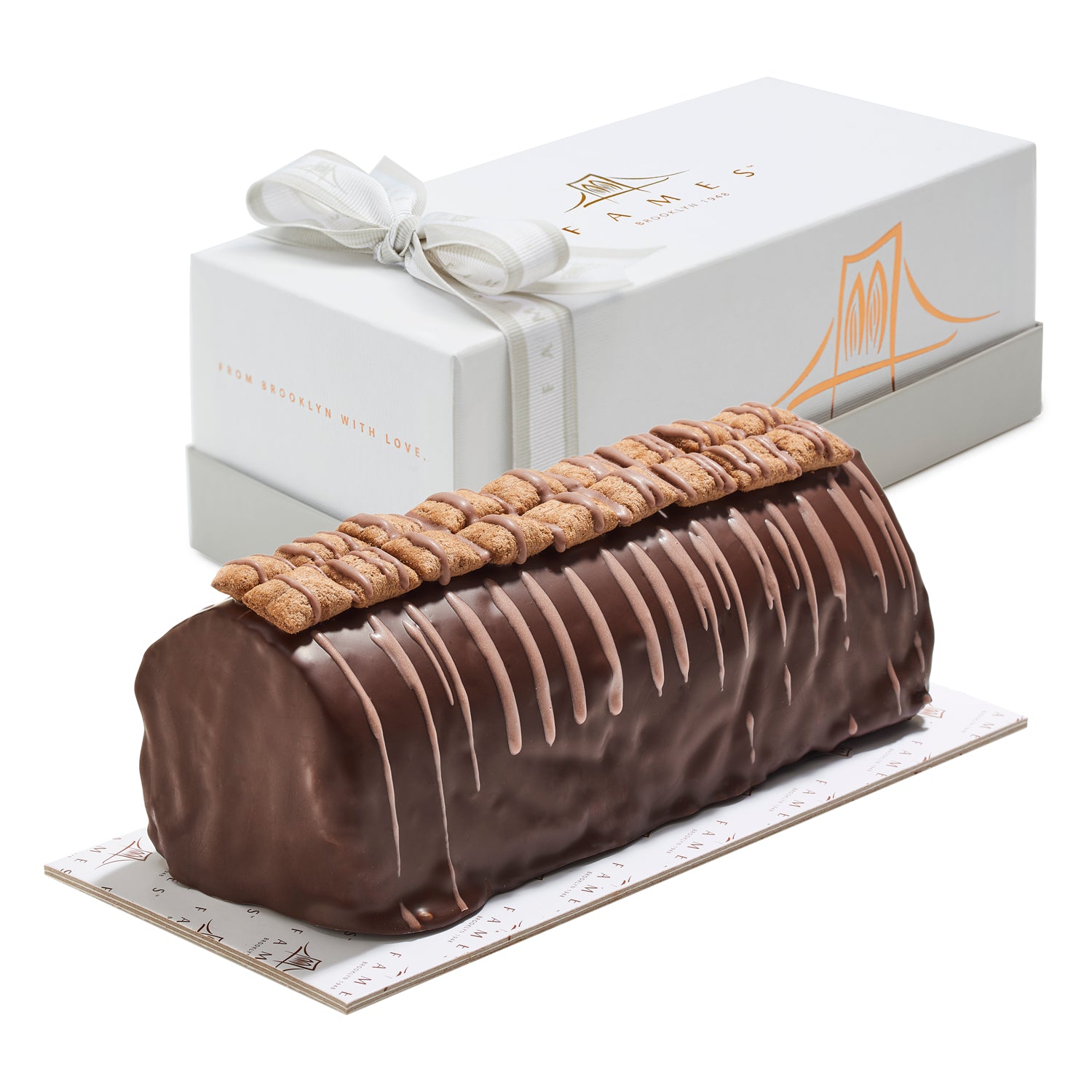 A beautifully packaged Crispy Chocolate Log in a gift box, showcasing its rich chocolate exterior and crunchy texture.