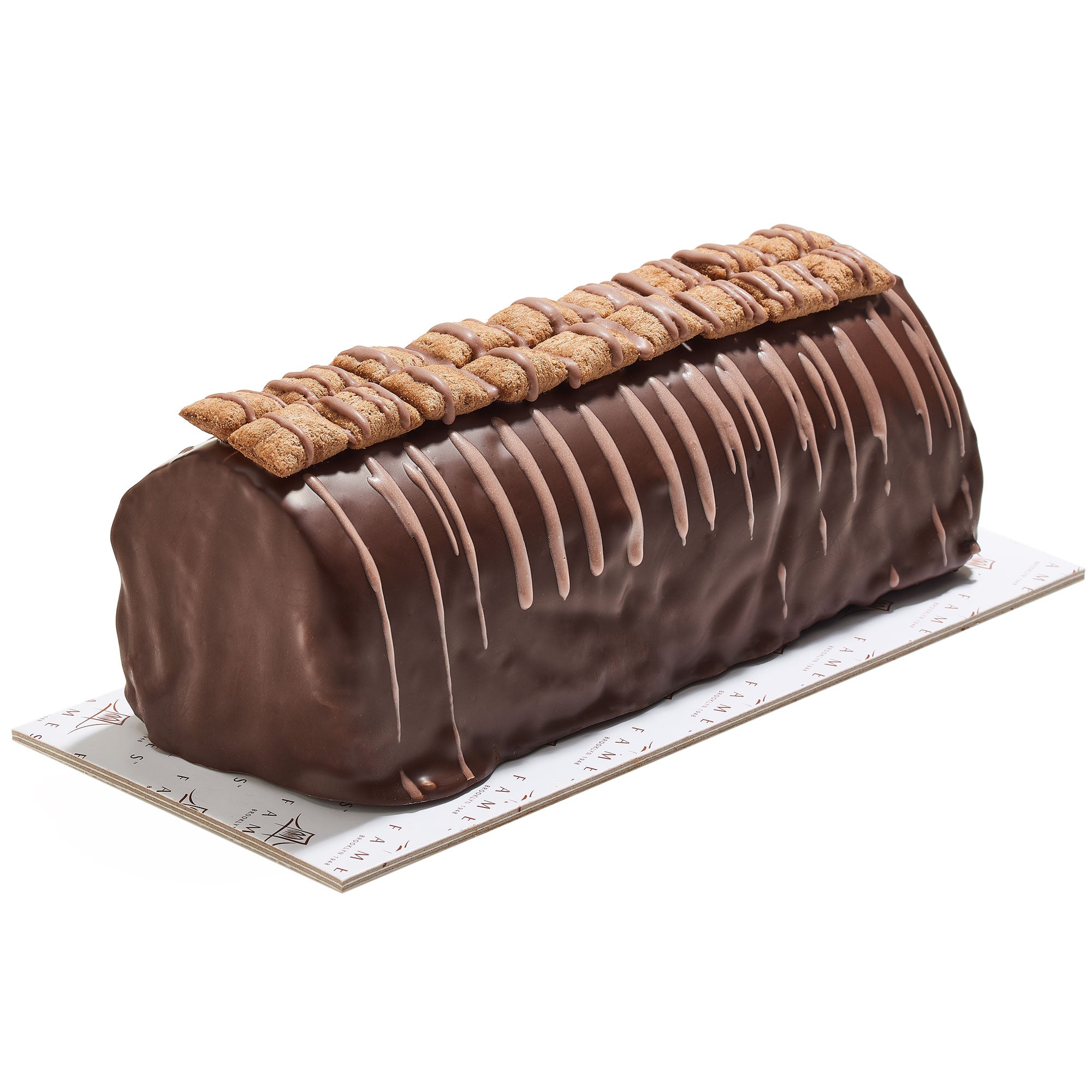 A beautifully packaged Crispy Chocolate Log in a gift box, showcasing its rich chocolate exterior and crunchy texture.