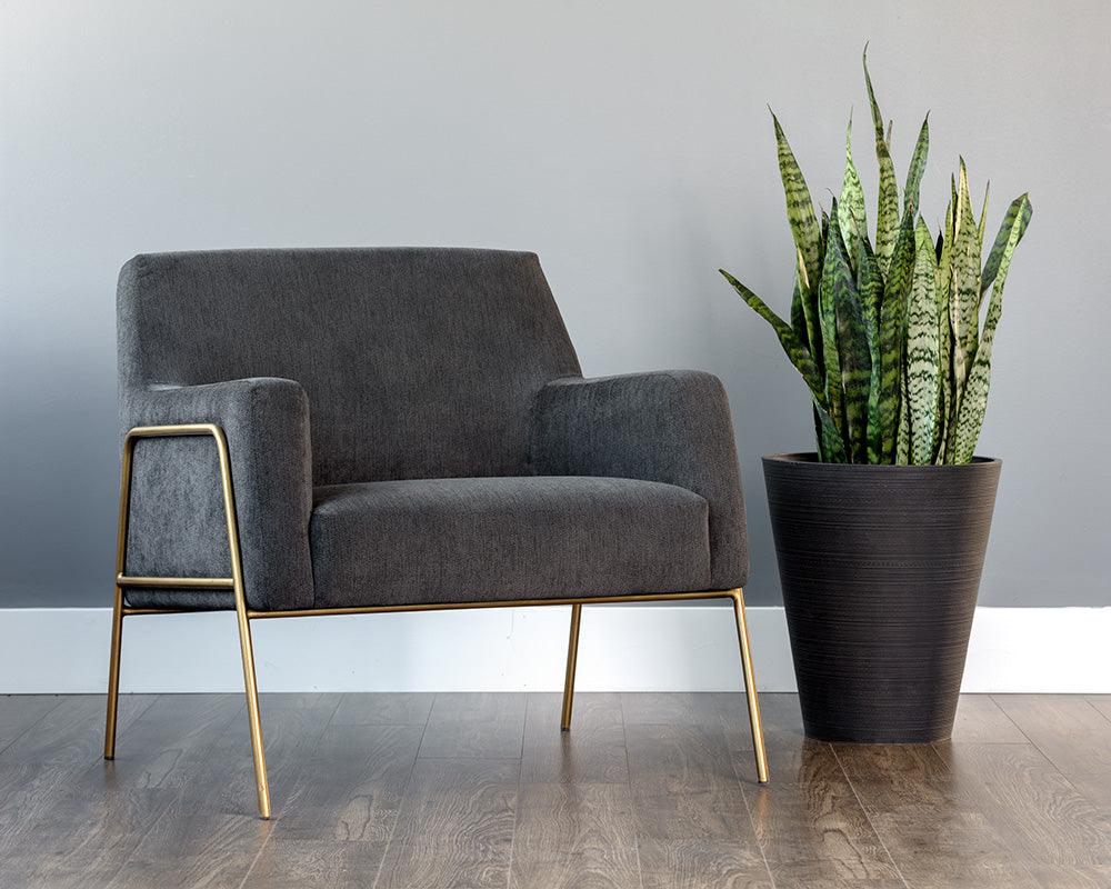 Cybil Lounge Chair in Polo Club Kohl Grey with antique brass legs, showcasing modern design and comfortable seating.