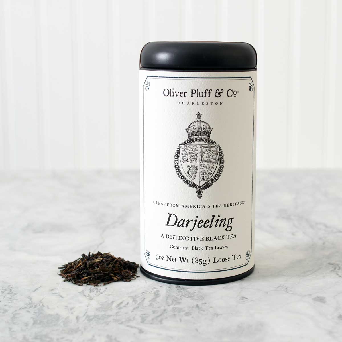 Darjeeling Loose Tea in a matte black signature tin, showcasing the premium quality of the tea leaves inside.