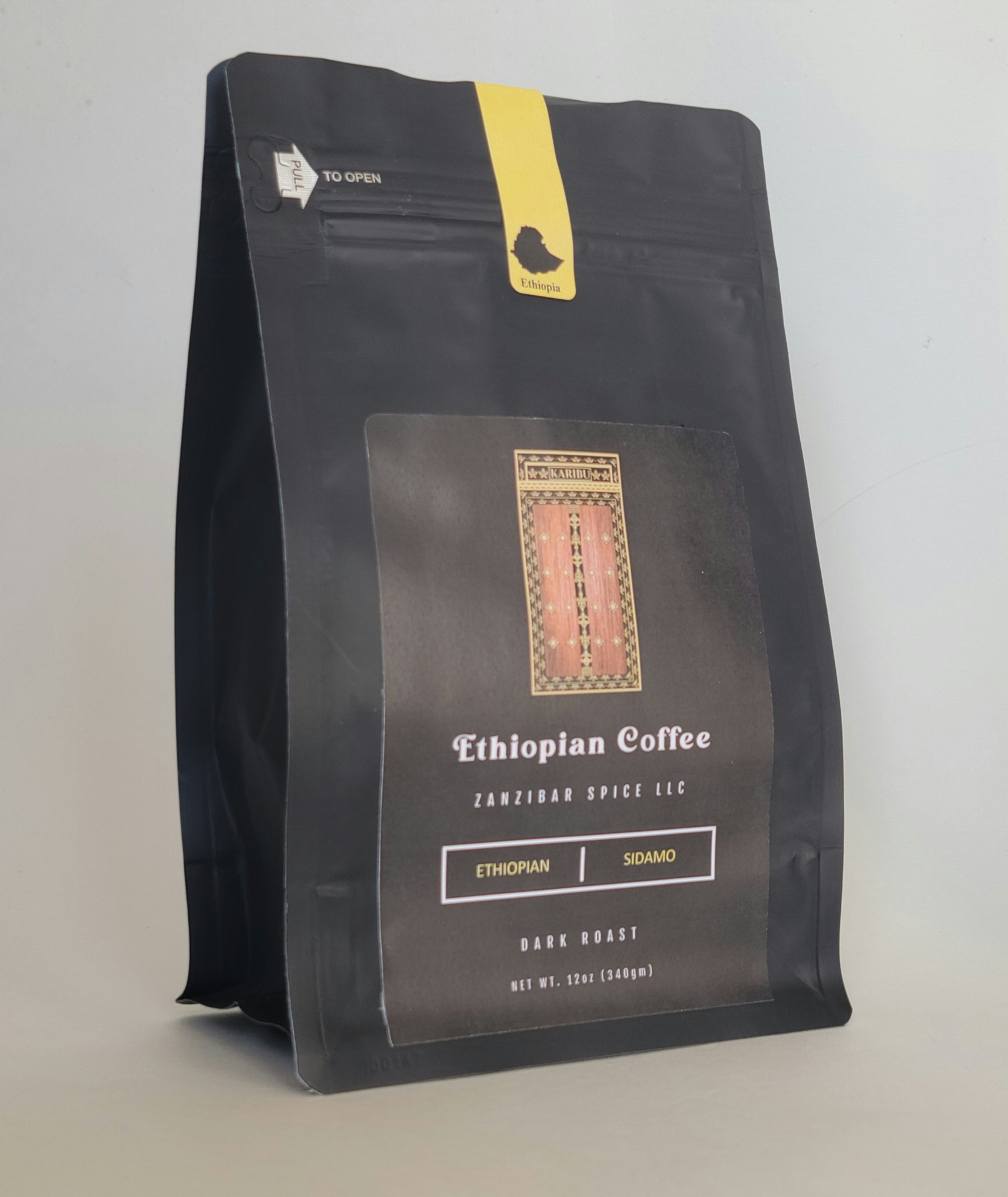 A 12oz resealable bag of Dark Roast Ethiopia Sidamo coffee showcasing its rich, dark beans.