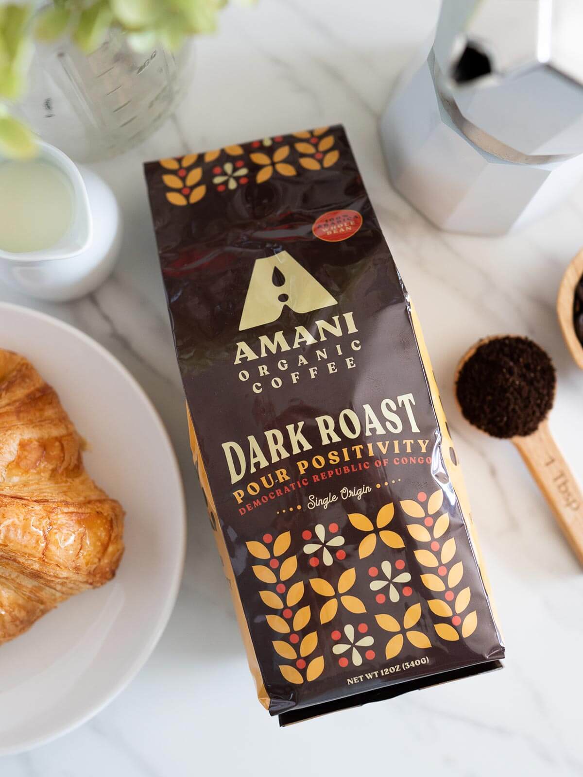 A bag of Dark Roast Single Origin Organic Coffee showcasing its rich, dark beans and vibrant packaging, highlighting its organic and single origin qualities.