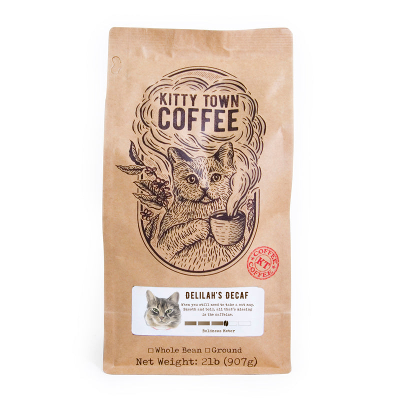 A cozy cup of Delilah's Decaf coffee with a warm, fruity aroma, perfect for relaxation.