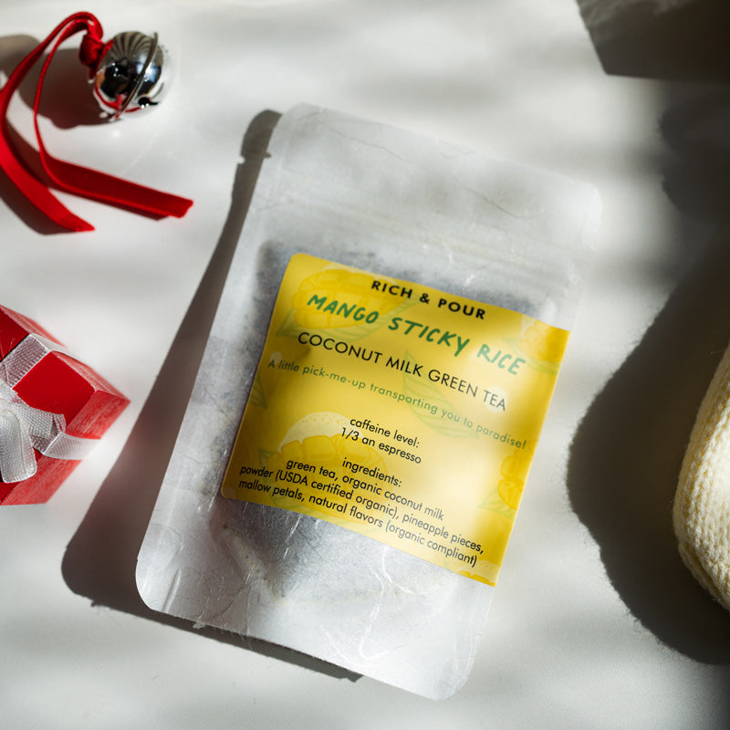 A beautifully arranged Dessert Lovers Set featuring three unique tea blends: Blueberry Pie, Mango Sticky Rice, and Creamsicle, all in elegant packaging.