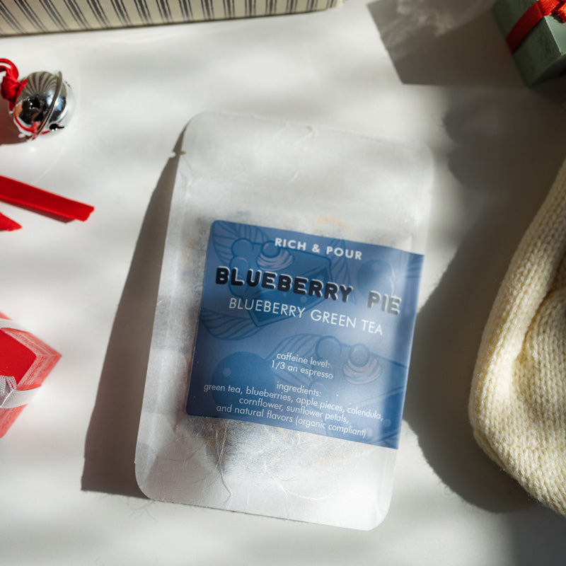 A beautifully arranged Dessert Lovers Set featuring three unique tea blends: Blueberry Pie, Mango Sticky Rice, and Creamsicle, all in elegant packaging.