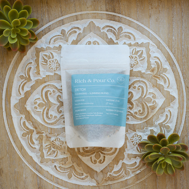 A vibrant package of Detox: Cleansing Blend featuring herbal ingredients like dandelion, ginger, and burdock root, promoting natural detoxification.