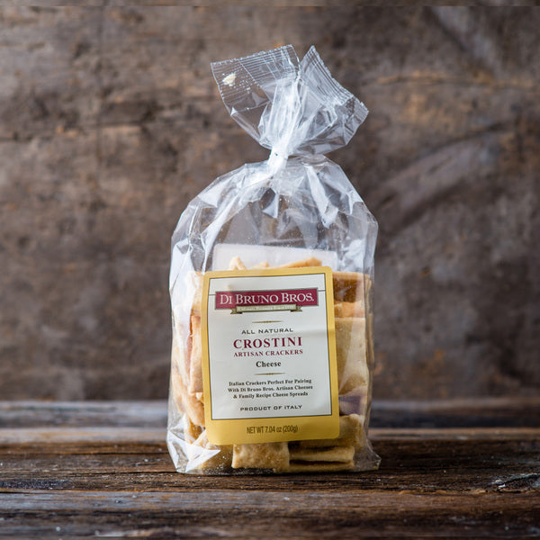 A close-up of Dibruno Brothers Cheese Crostini, showcasing their crispy texture and golden-brown color, perfect for pairing with various cheeses.