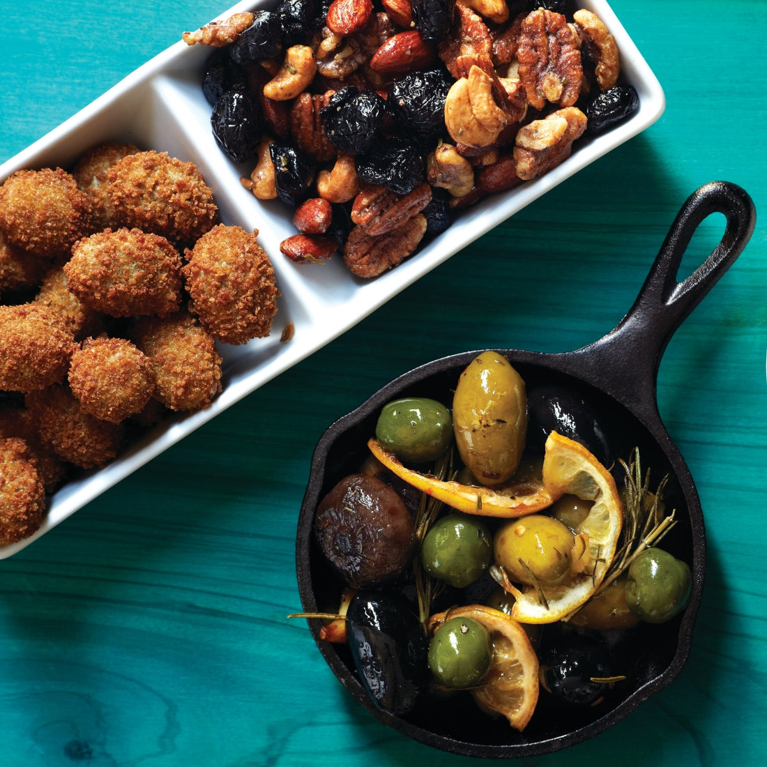 A jar of DiVina Feta Stuffed Olives, showcasing plump green olives filled with creamy feta cheese, perfect for appetizers.