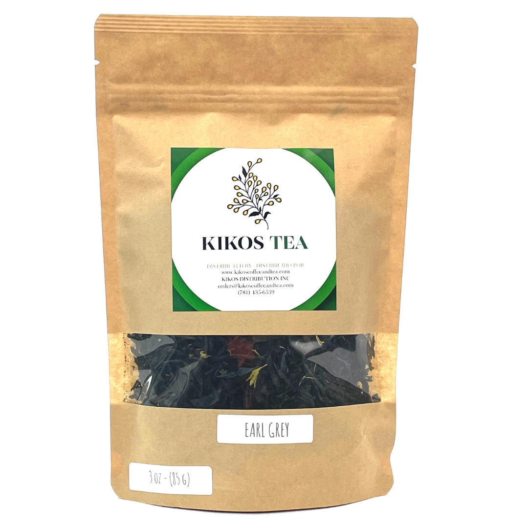 A cup of Earl Grey Tea with loose leaf tea and bergamot, showcasing its rich color and aroma.