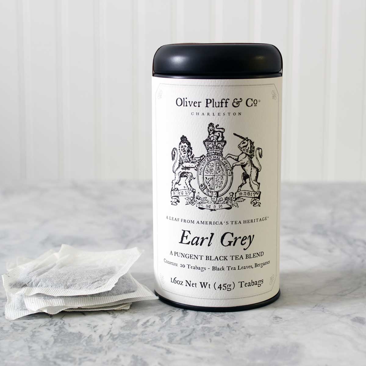 Earl Grey Teabags in a stylish matte black tea tin, featuring pyramid style teabags with bergamot citrus aroma.